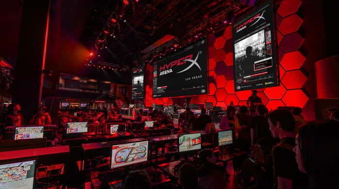 An image of a crowd and large screens at HyperX Arena.