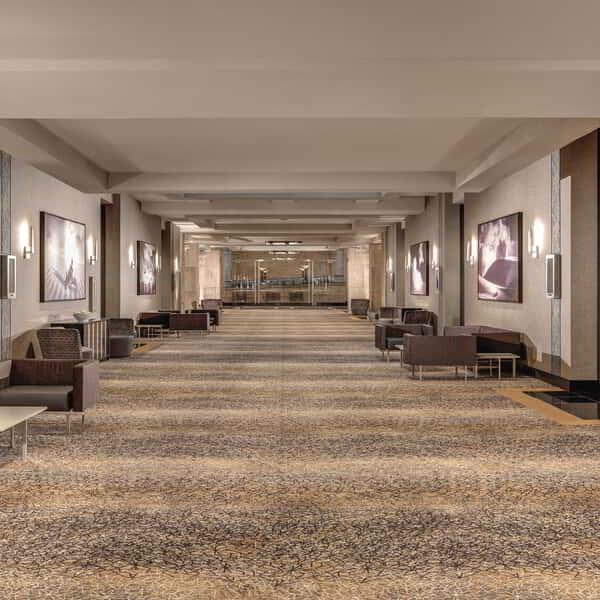 Our wide hallway with seating inside our convention space. is perfect for your next event.